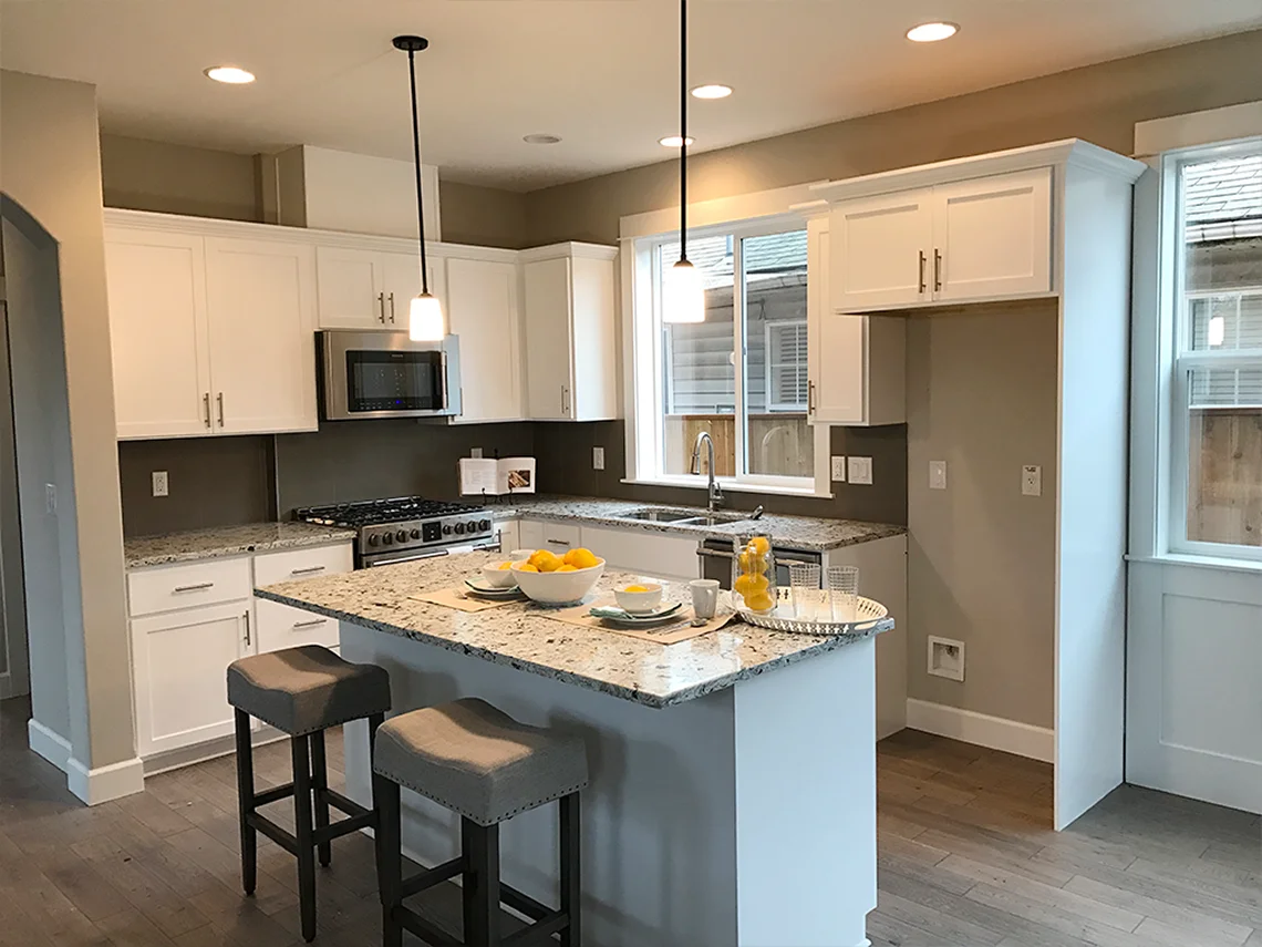 Bright White Shaker Cabinets & Granite Countertops 1