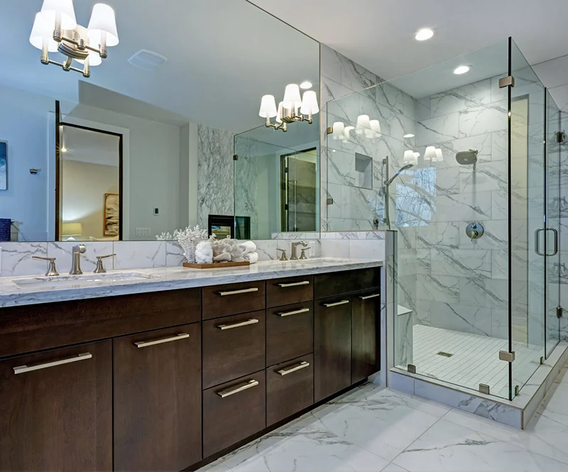 Elegant Remodeled Bathroom With Dark Wood Cabinets And Custom Glass Shower 800x665